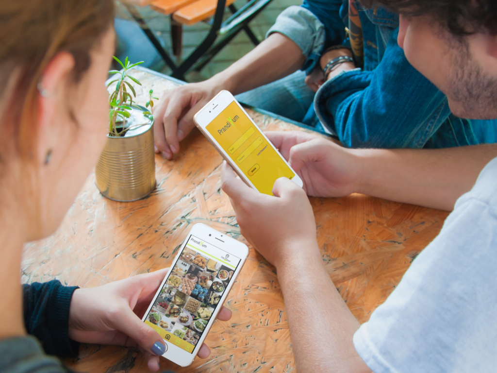 Group of diverse users exploring PrandiYum culinary app together